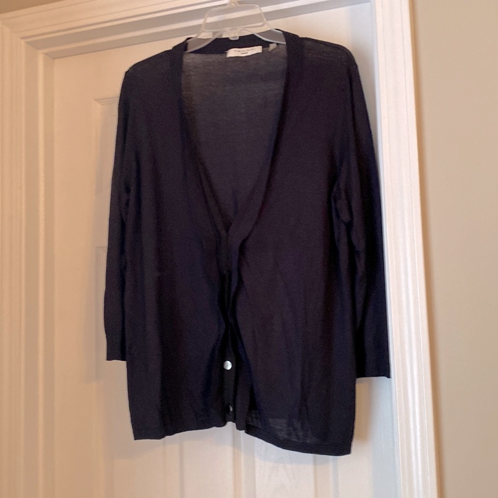 Navy cardigan with black ribbon button closure